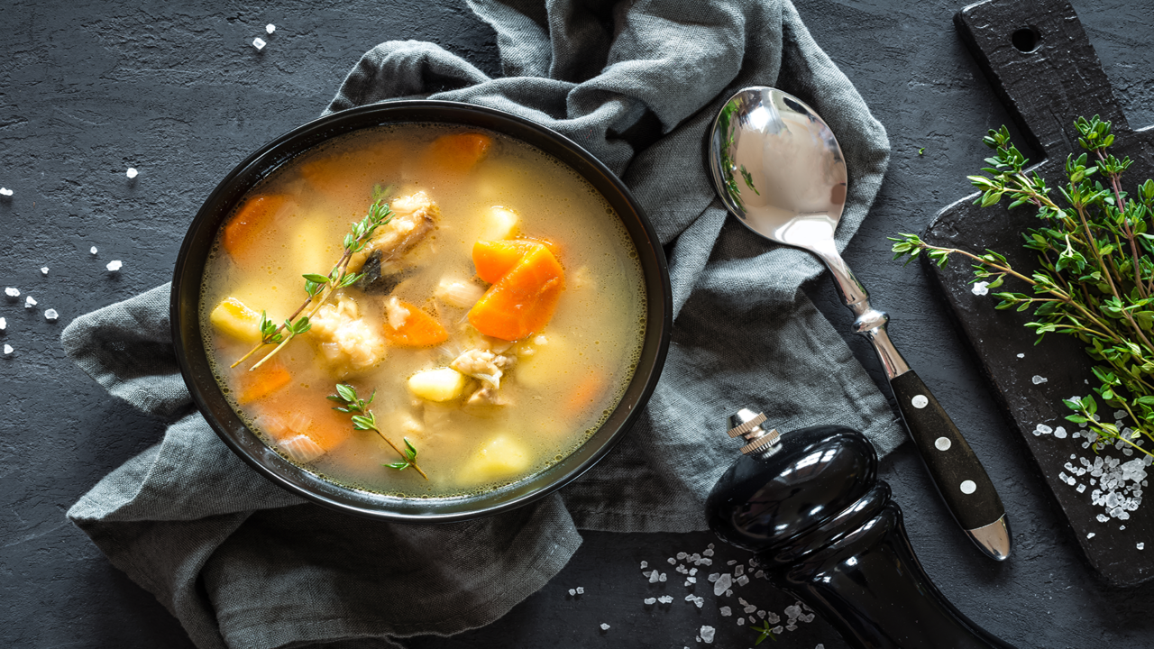 fresh-fish-soup-in-bowl-on-dark-background-top-vi-2021-08-26-17-20-31-1